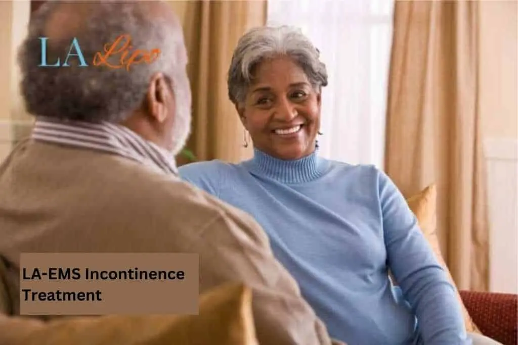 Couple sat smiling at each other - LA-EMS treatment East Grinstead